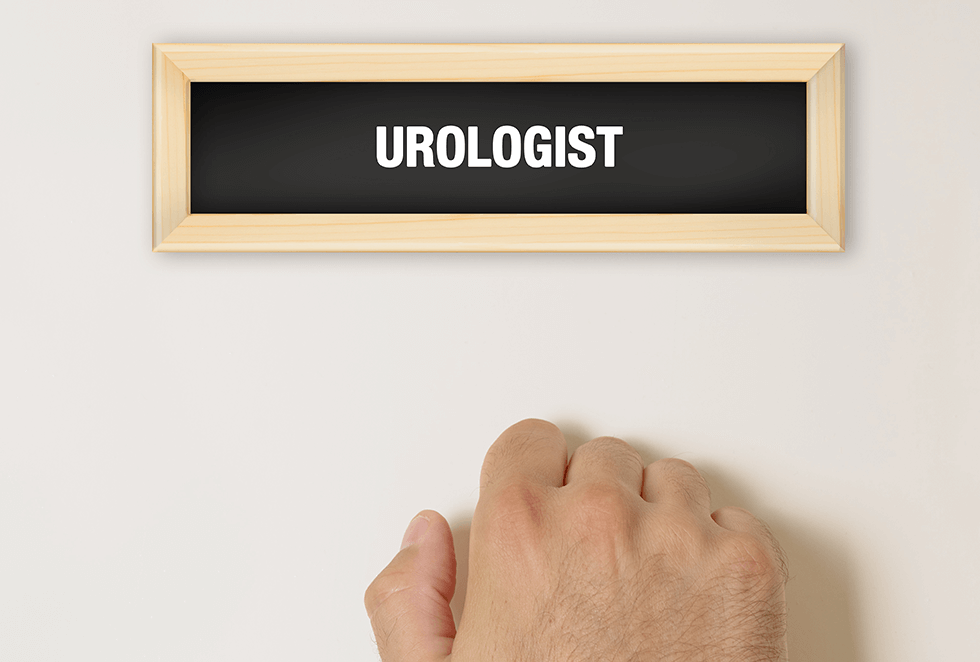 Hand knocking on urologist's door.